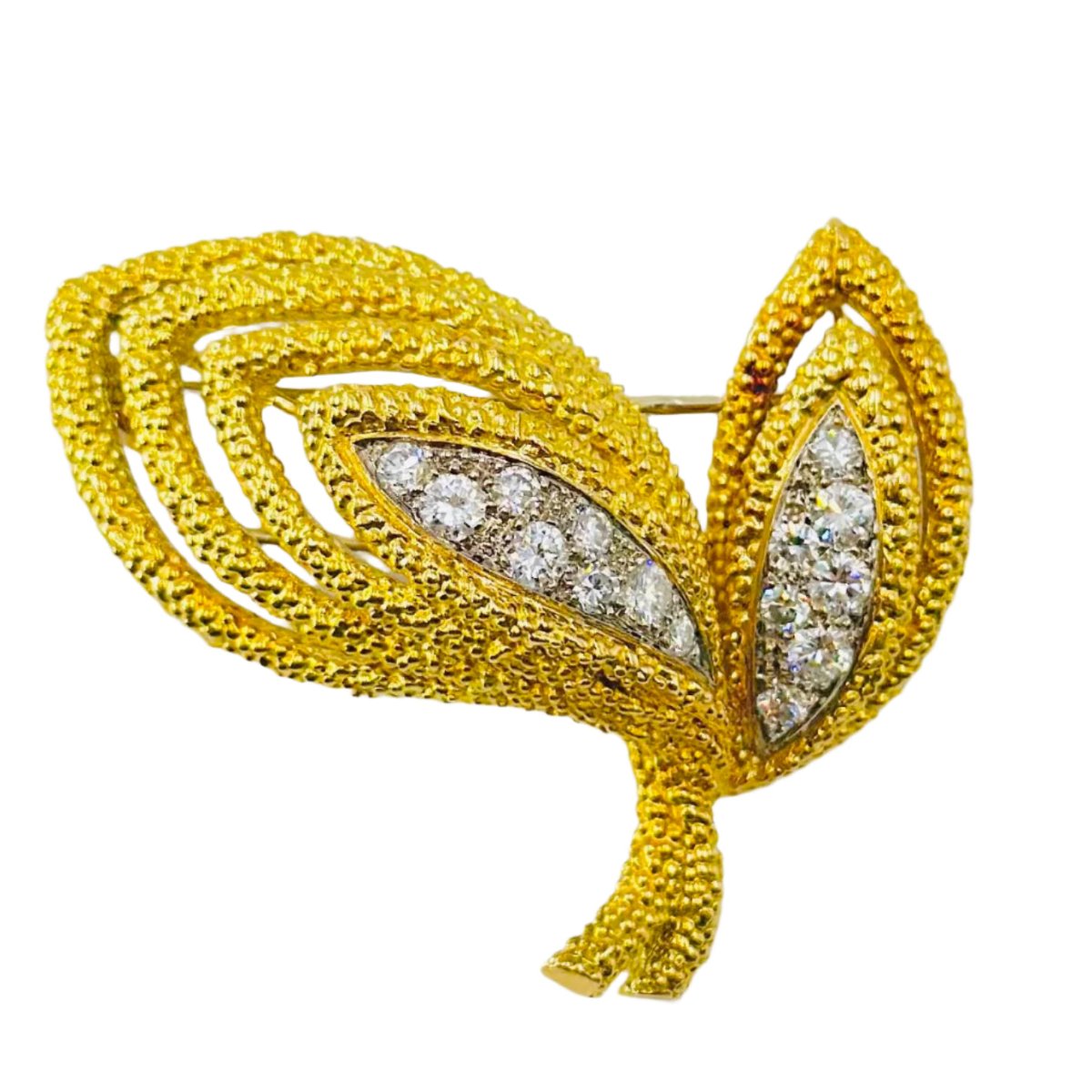 VAN CLEEF & ARPELS “Leaves” clip brooch in yellow gold and