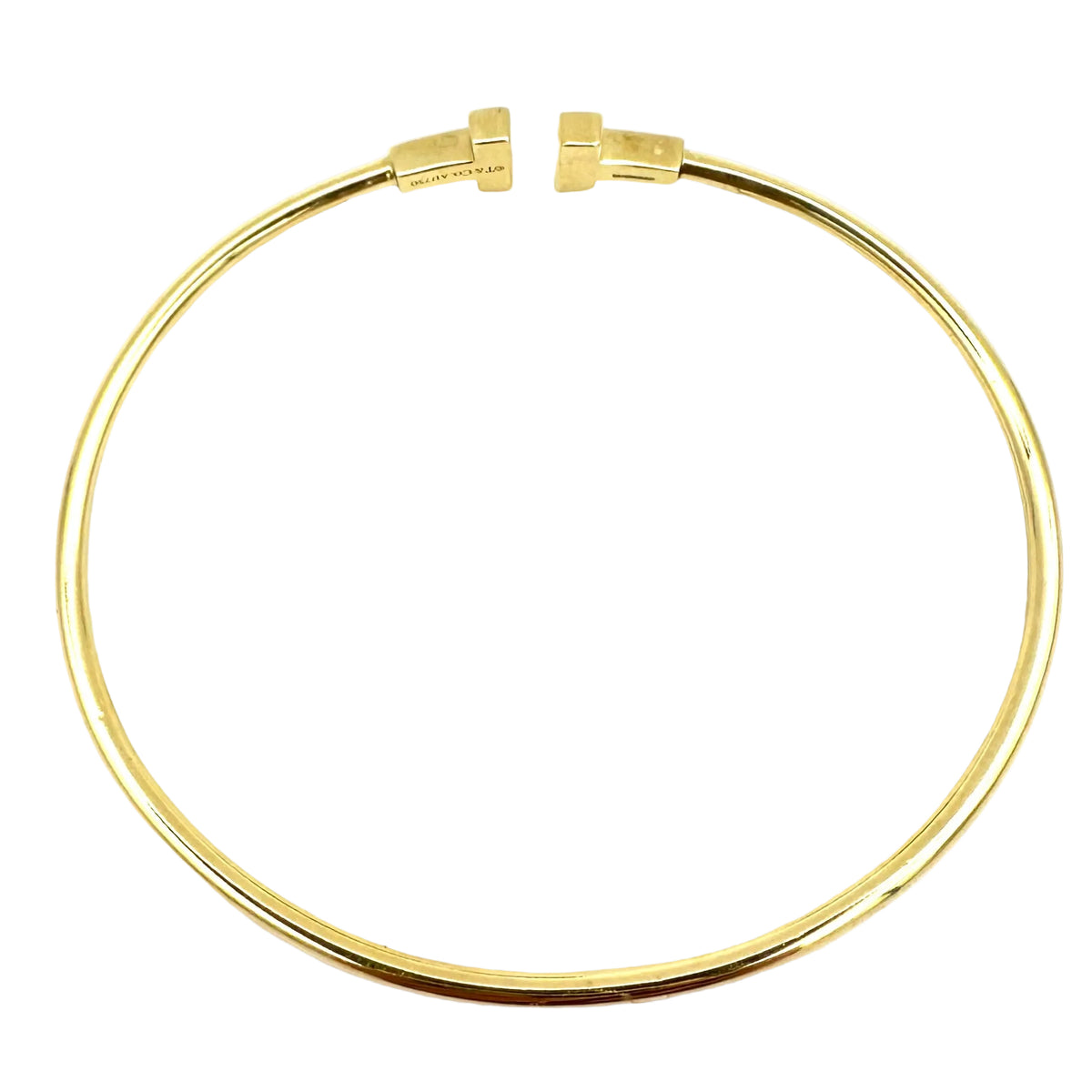 TIFFANY & CO. "Tiffany T" Yellow Gold Bangle