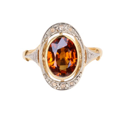 Bague en or jaune, platine, grenat et diamants
