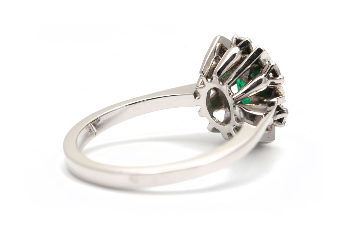 "Entourage" Ring in White Gold, Emerald, and Diamonds