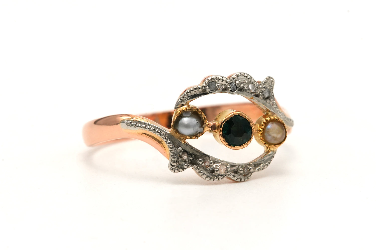 Yellow gold ring with an emerald, pearls, and diamonds