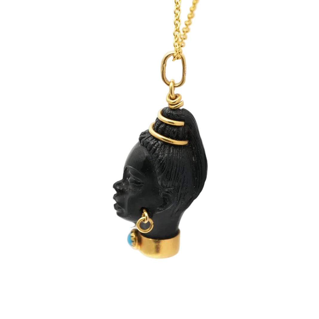 Yellow gold, ebony, and turquoise pendant
