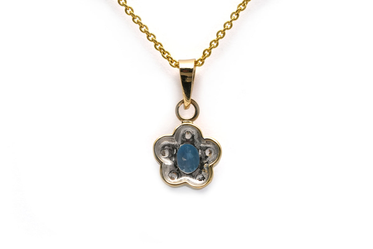 Pendant made of white gold, yellow gold, topaz, and diamonds