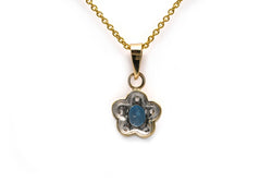 Pendant made of white gold, yellow gold, topaz, and diamonds