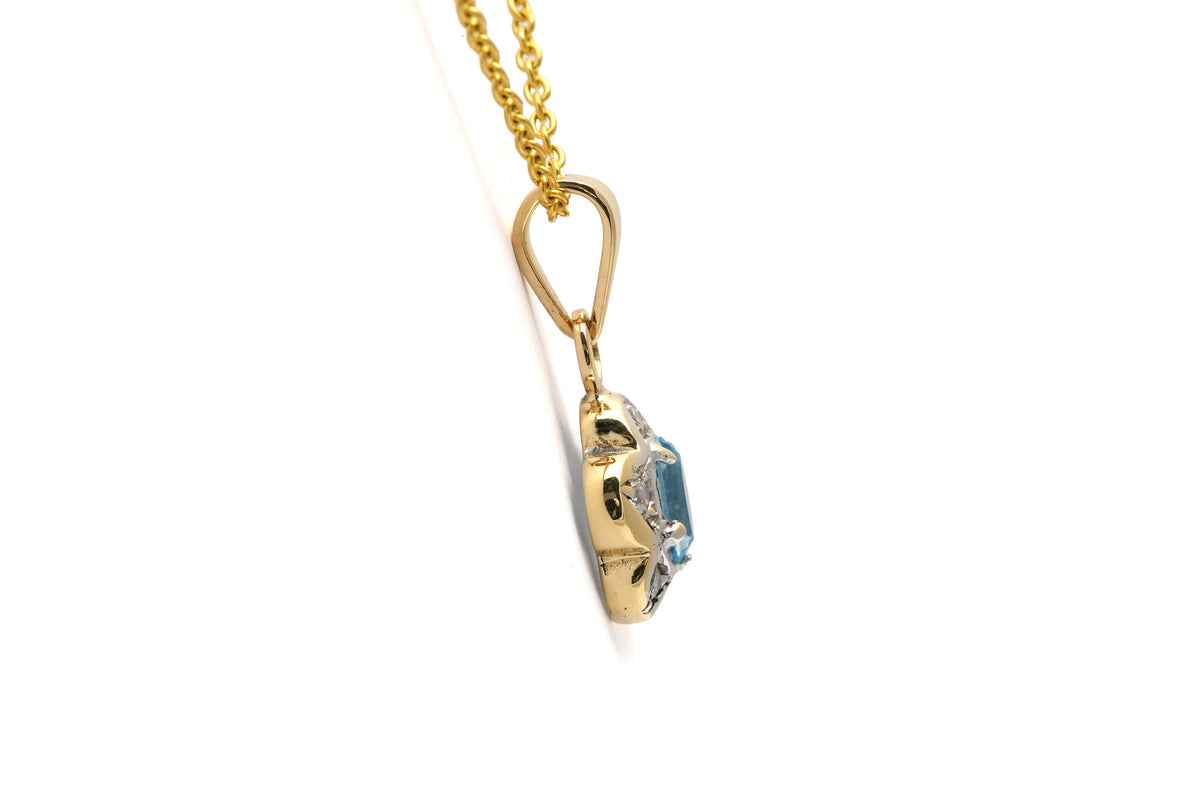 Pendant made of white gold, yellow gold, topaz, and diamonds