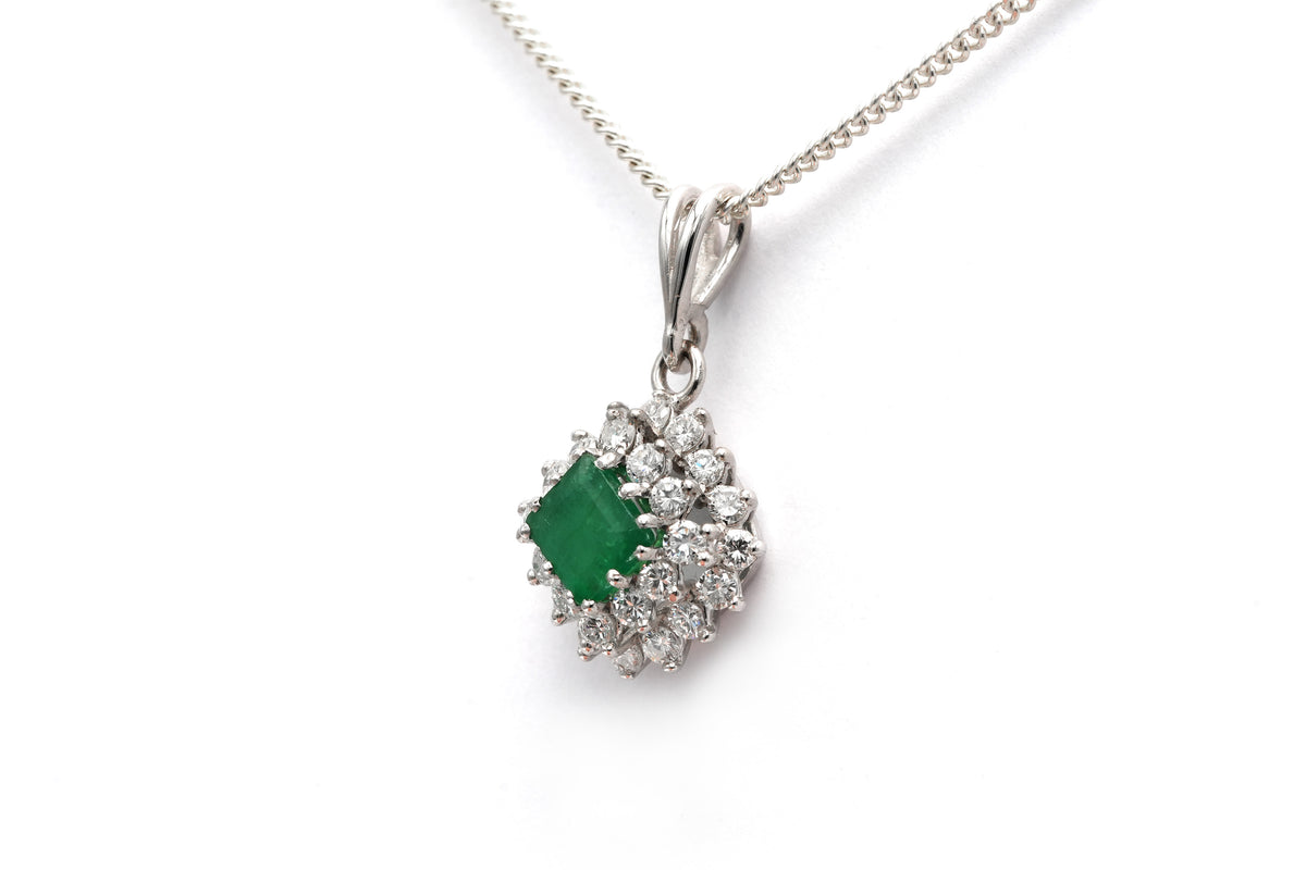 White gold pendant with emeralds and diamonds