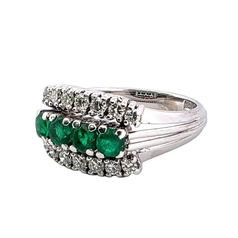 White gold ring with emeralds and diamonds