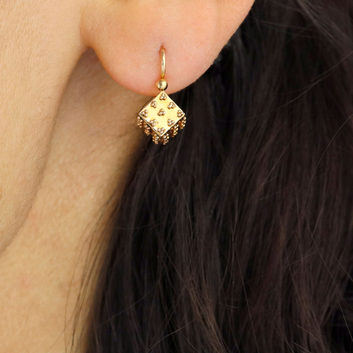 Single rose gold lever-back earring