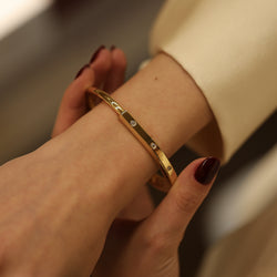 TIFFANY & CO. "Lock" Yellow Gold and Diamond Bangle