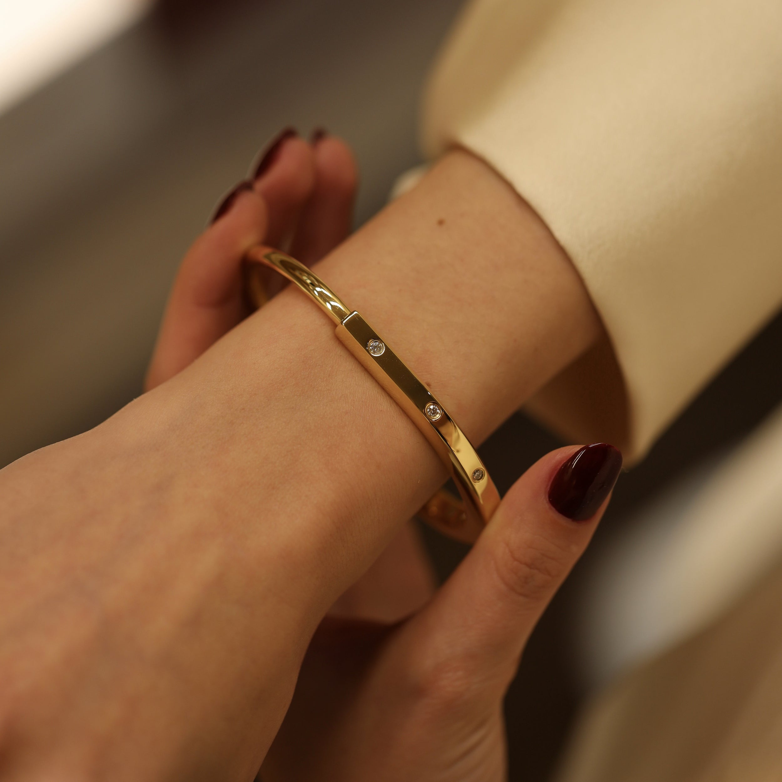 TIFFANY & CO. "Lock" Yellow Gold and Diamond Bangle