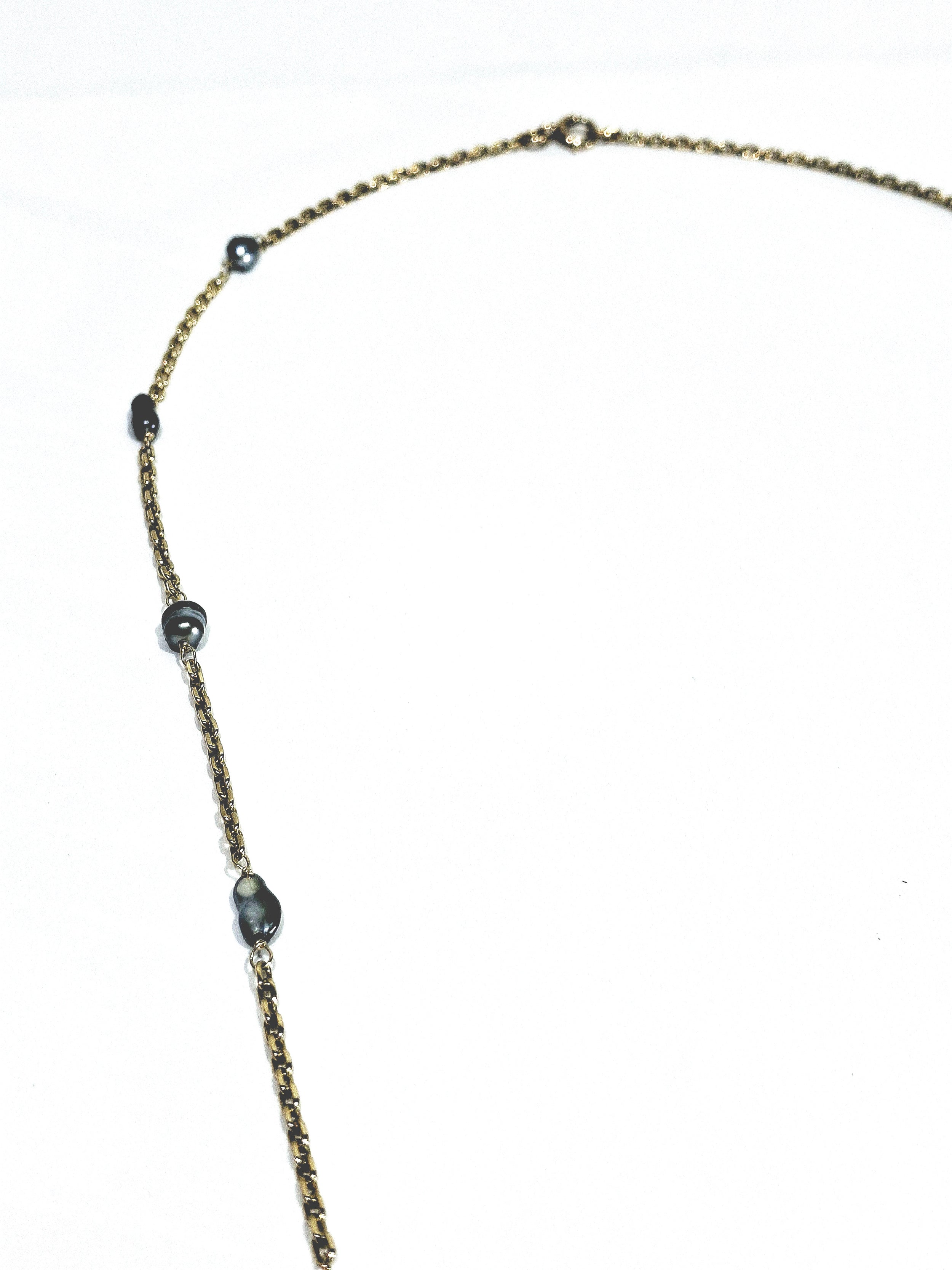 Rose gold long necklace with Tahitian pearls.