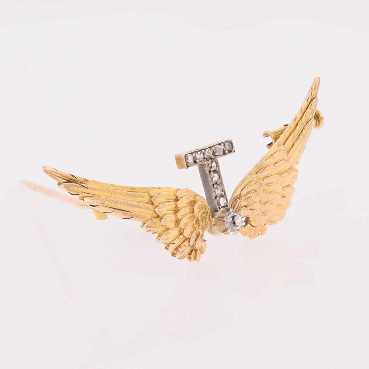 Broche en or jaune, argent et diamants