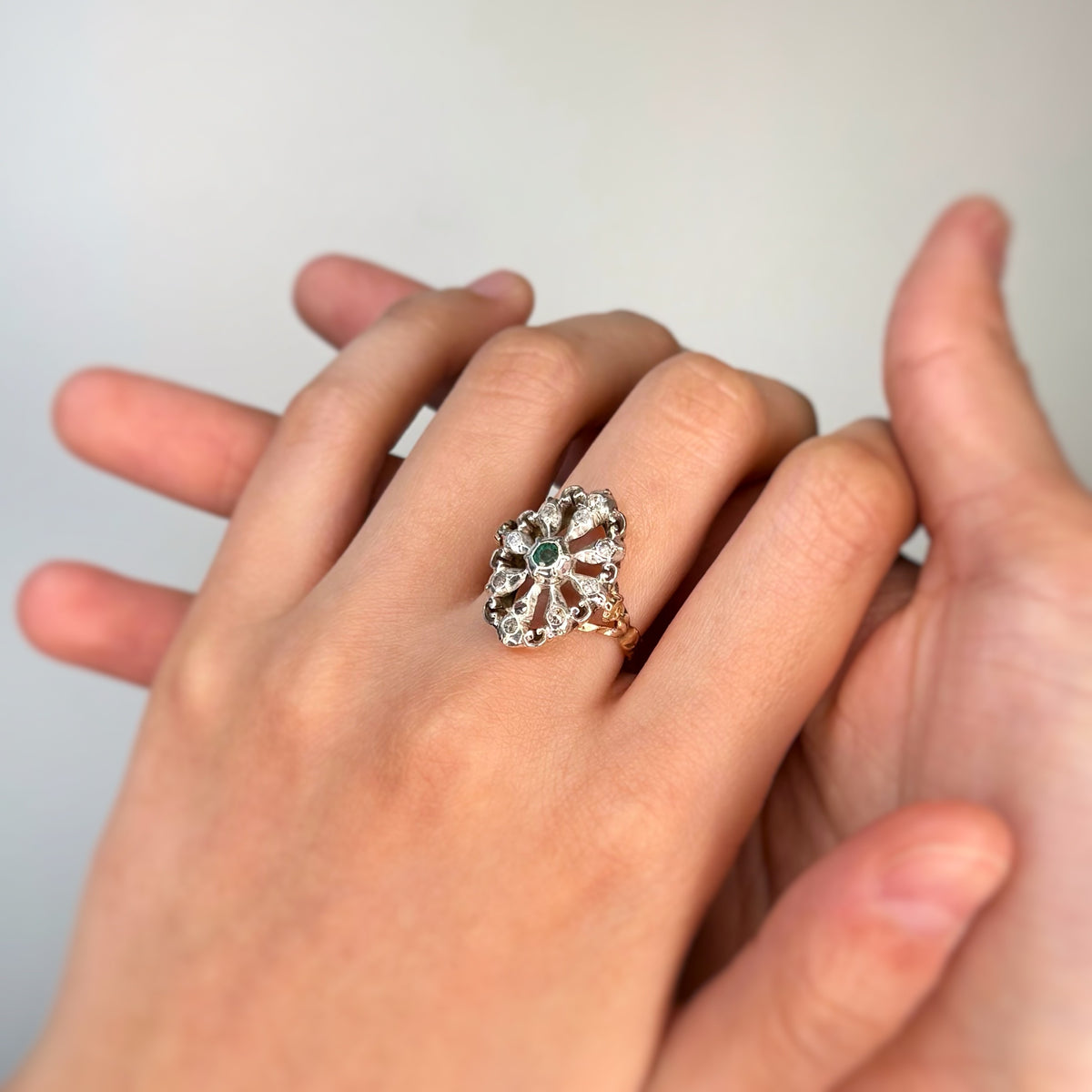 Ring in yellow gold, silver, emerald, and diamonds