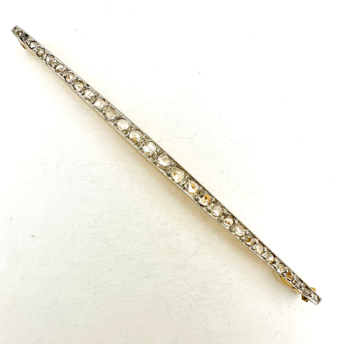 Art Deco Brooch in Yellow Gold, Platinum, and Diamonds