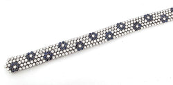 Flexible bracelet in white gold, sapphires, and diamonds