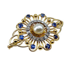 Gold brooch with sapphires, a pearl, and diamonds