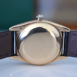 ROLEX "Oyster Perpetual Bubbleback Ovetto" watch in yellow gold and leather