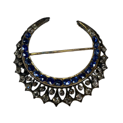 Brooch made of yellow gold, silver, sapphires, and diamonds