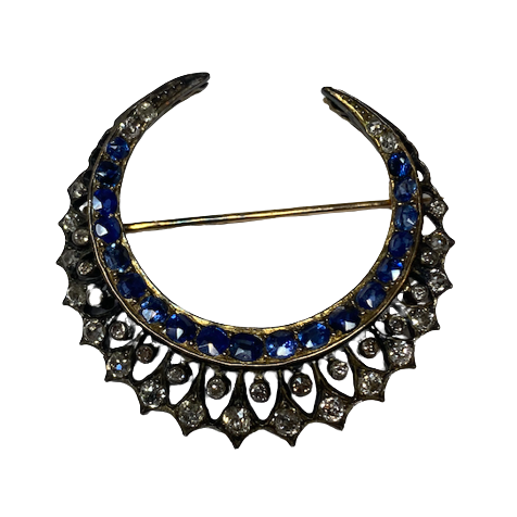 Brooch made of yellow gold, silver, sapphires, and diamonds