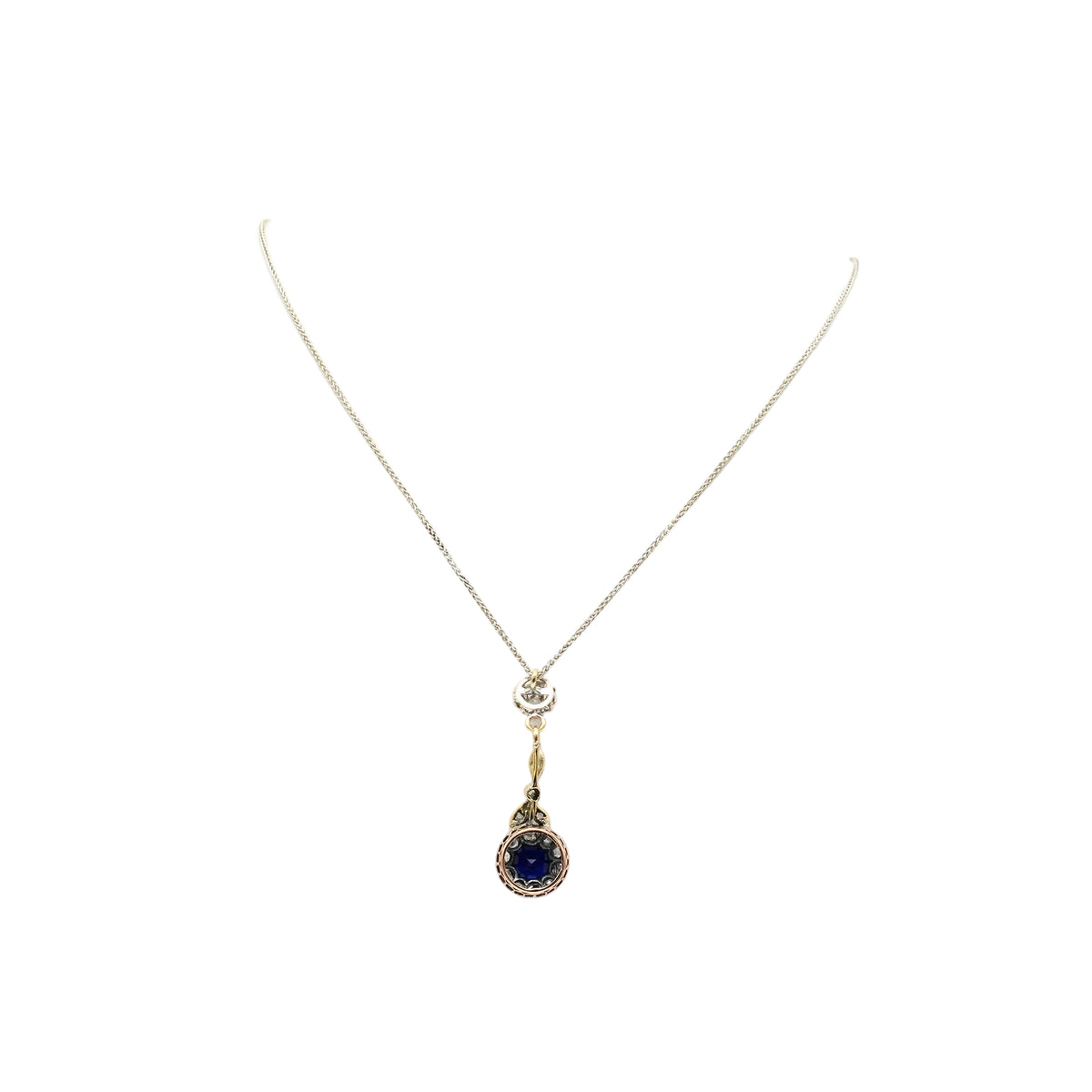 Necklace with a pendant made of yellow gold, silver, sapphire, and diamonds