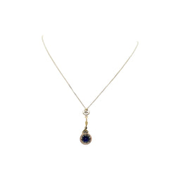 Necklace with a pendant made of yellow gold, silver, sapphire, and diamonds