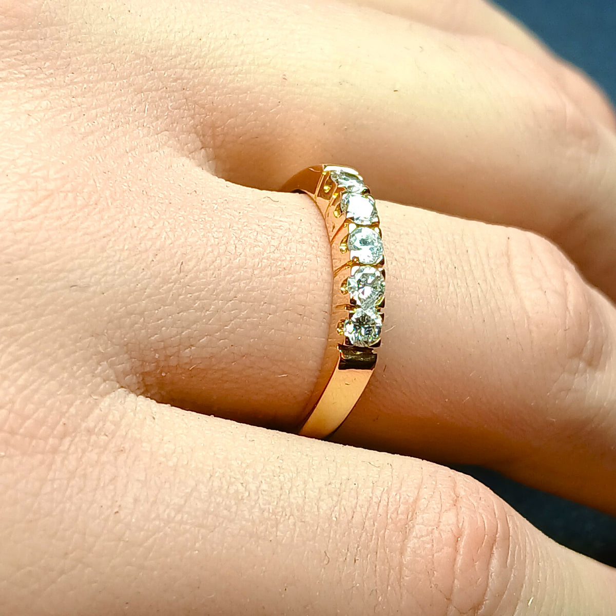 Half wedding band in rose gold and diamonds