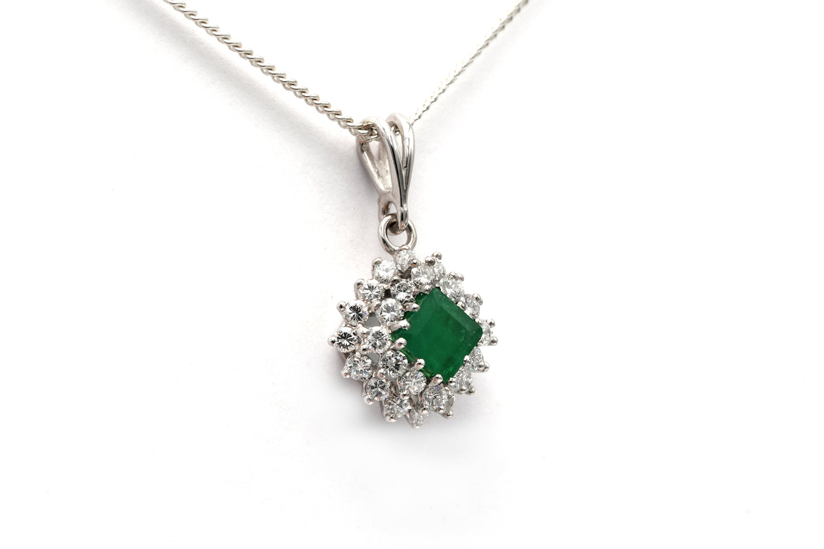 White gold pendant with emeralds and diamonds