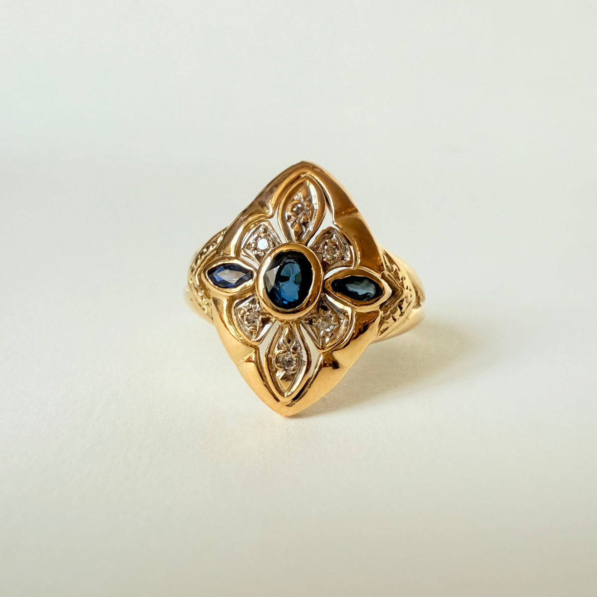 Marquise Ring in yellow gold, white gold, sapphire, and diamonds