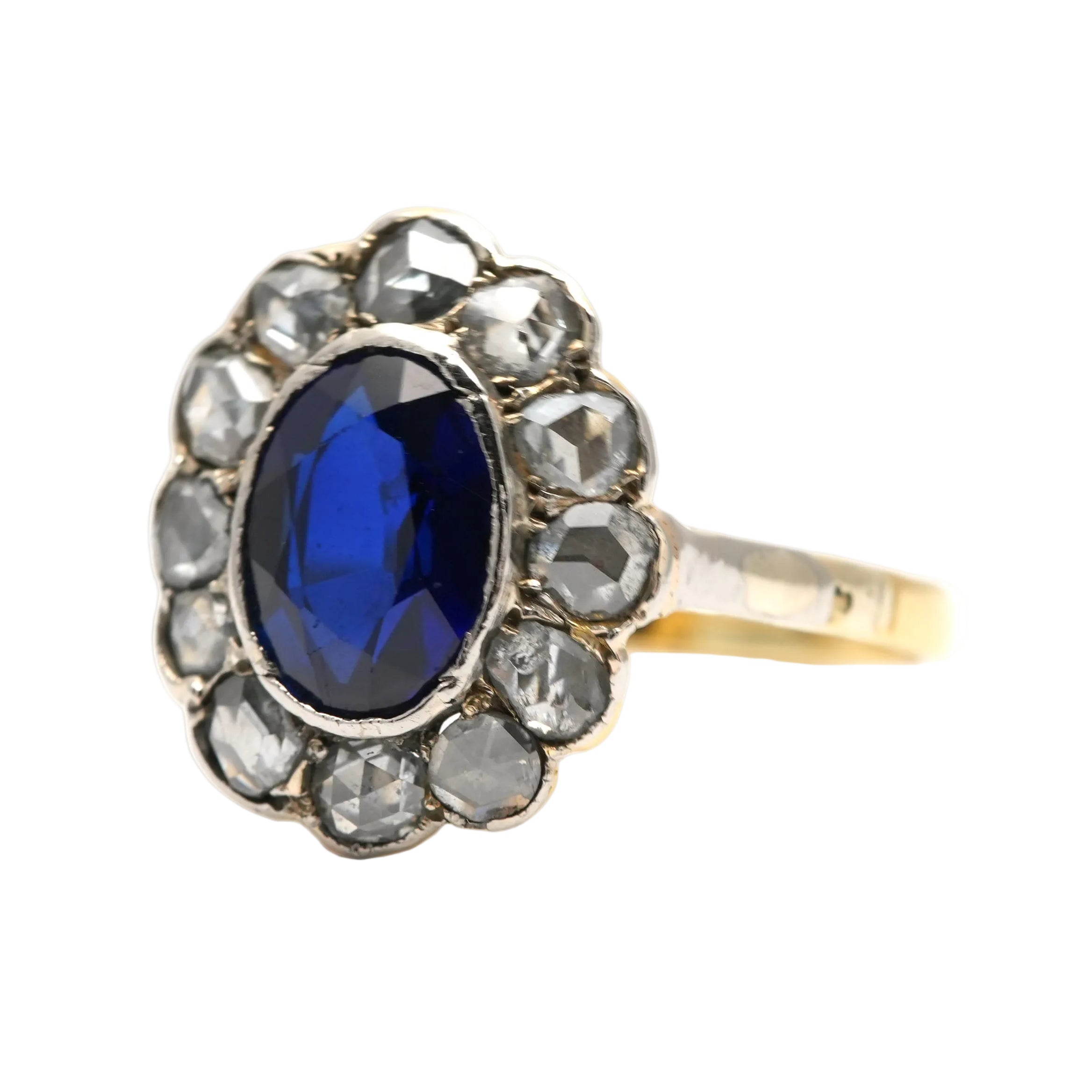 Entourage Ring in white gold, yellow gold, sapphire, and diamonds