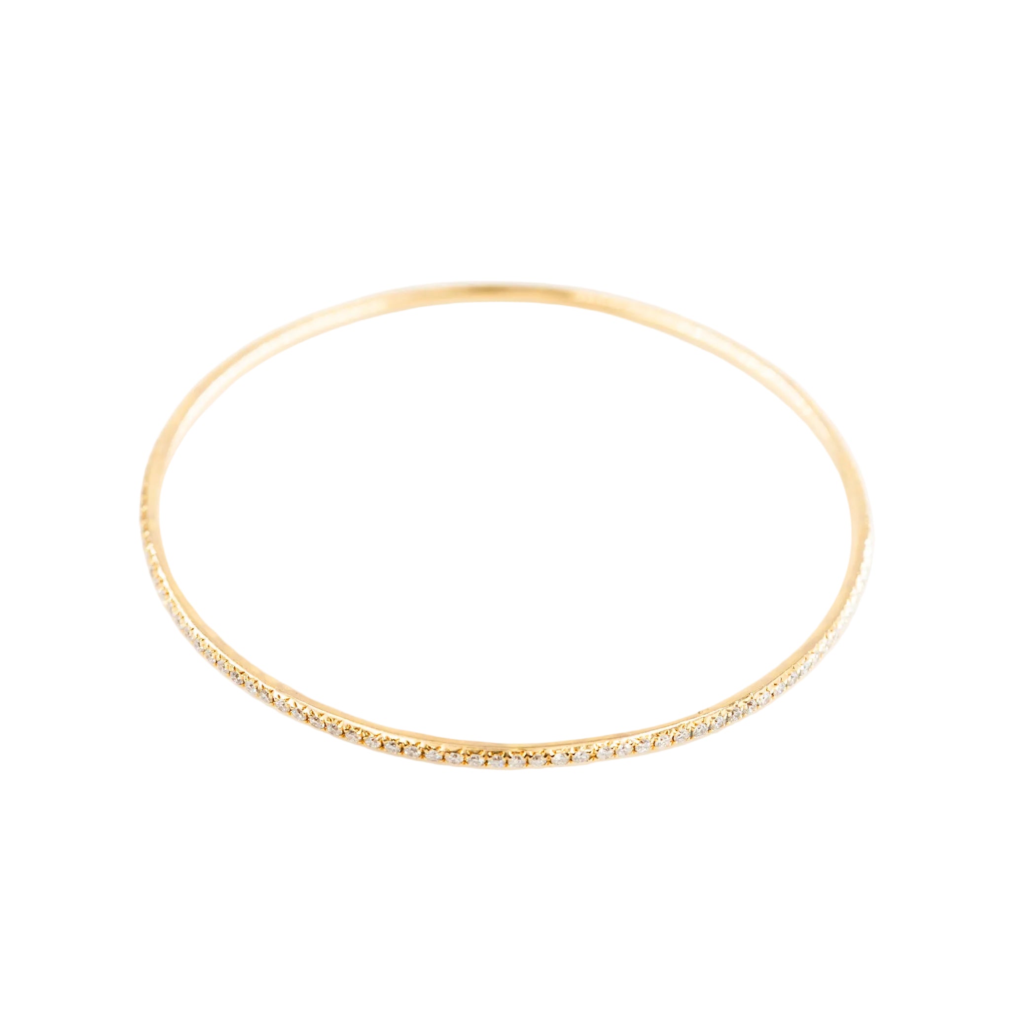Three bangle bracelets in white gold, yellow gold, rose gold, and diamonds
