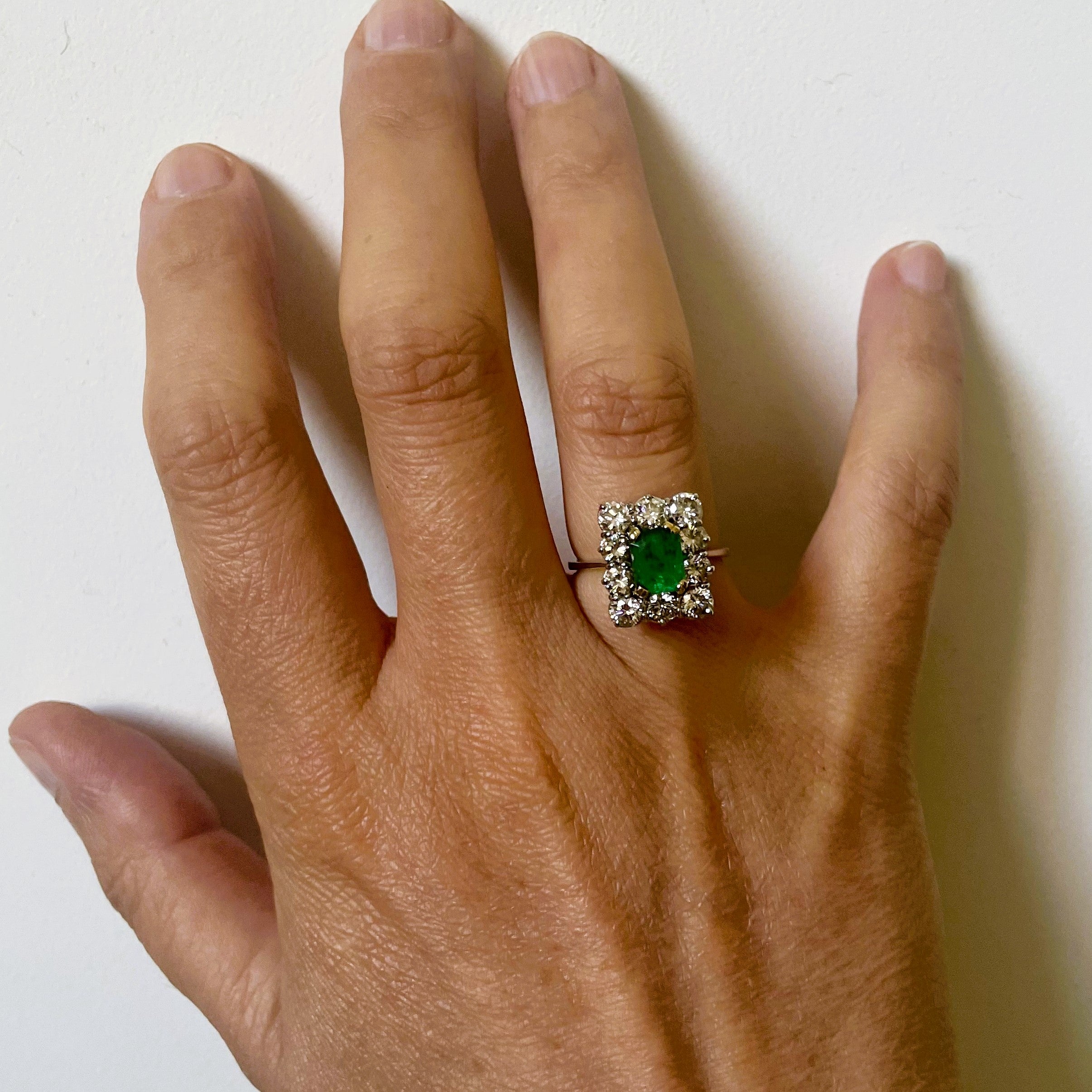 Entourage Ring with Emeralds and Diamonds in White Gold and Platinum