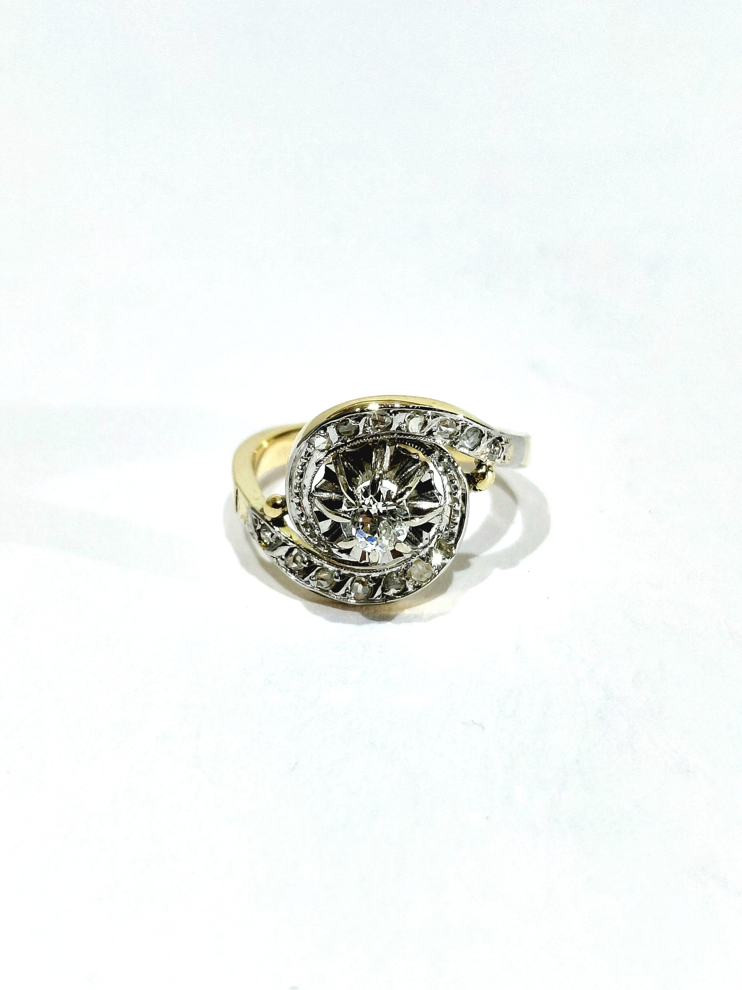 Tourbillon ring in yellow gold, white gold, and diamonds