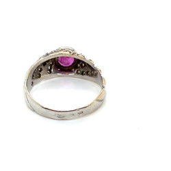 Gold bangle ring with a pink sapphire and diamonds