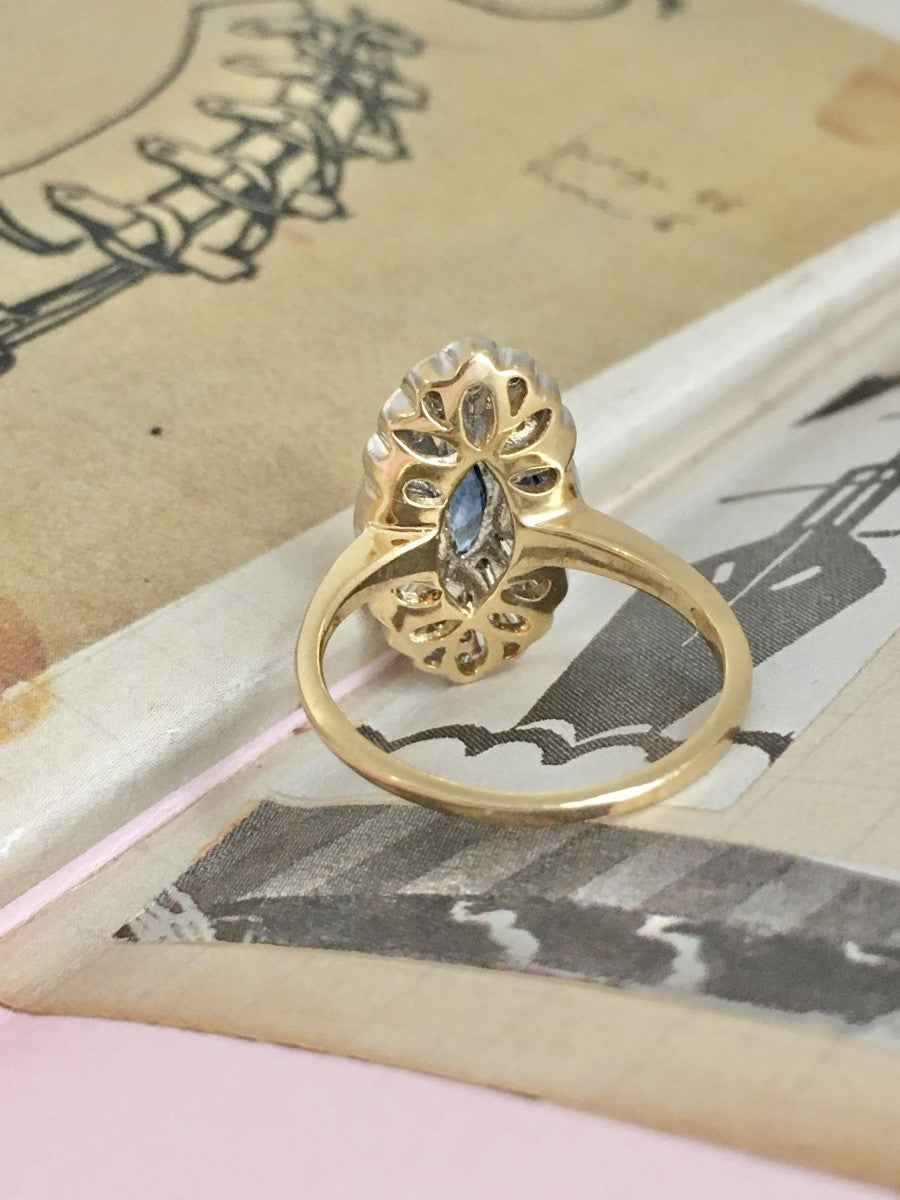 Entourage Ring in yellow gold, platinum, sapphire, and diamonds