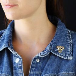 Brooch in white gold, yellow gold, green gold, and diamonds