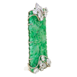 CARTIER Clip Brooch in white gold, platinum, jade, and diamonds