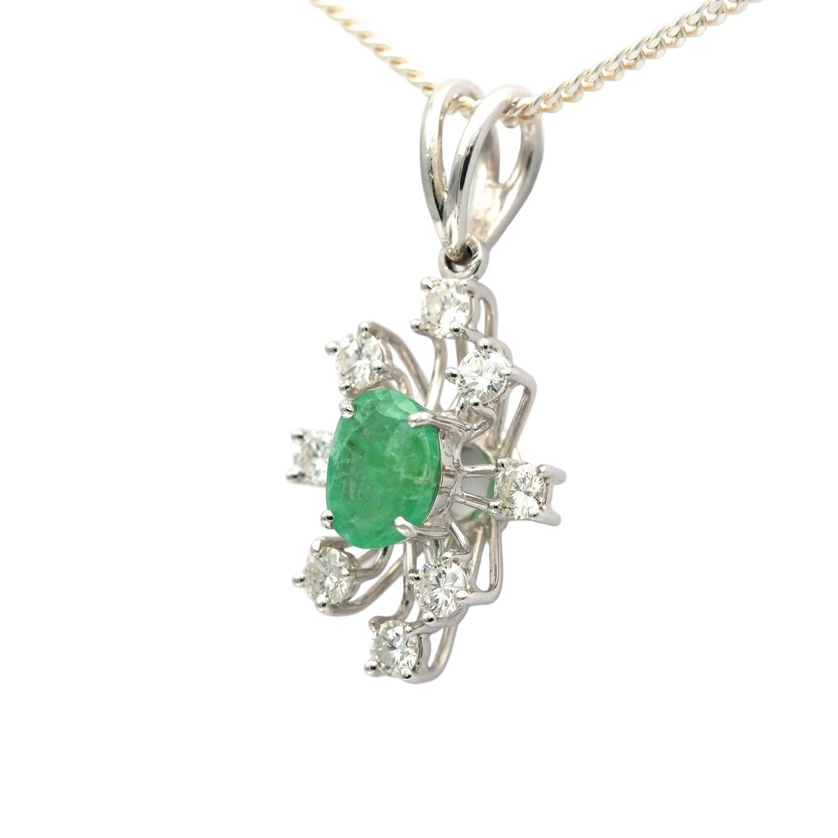 White gold pendant with emeralds and diamonds