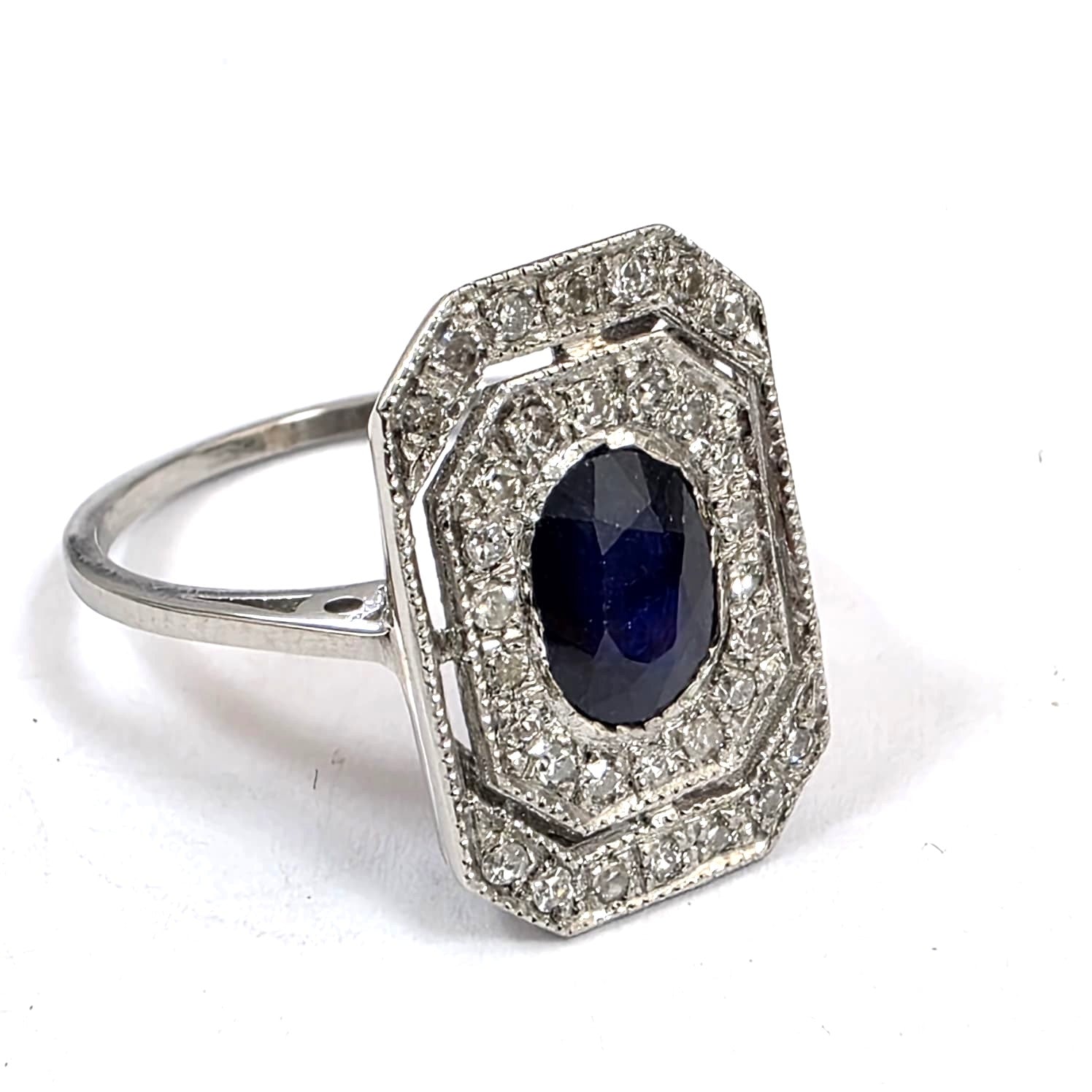 "Entourage" Ring in White Gold, Sapphire, and Diamonds