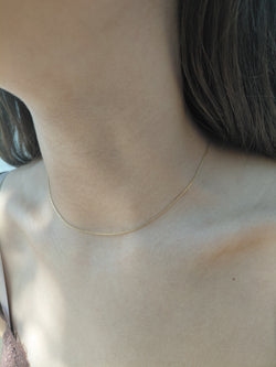 Yellow gold forçat-link chain