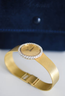 CHOPARD watch, Ref. 810, 18-carat yellow gold and diamonds, solid gold integrated bracelet, circa 1980.