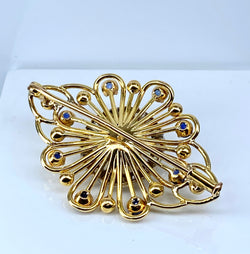 Gold brooch with sapphires, a pearl, and diamonds