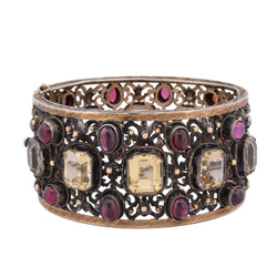 Cuff bracelet in yellow gold, silver, beryls, and garnets