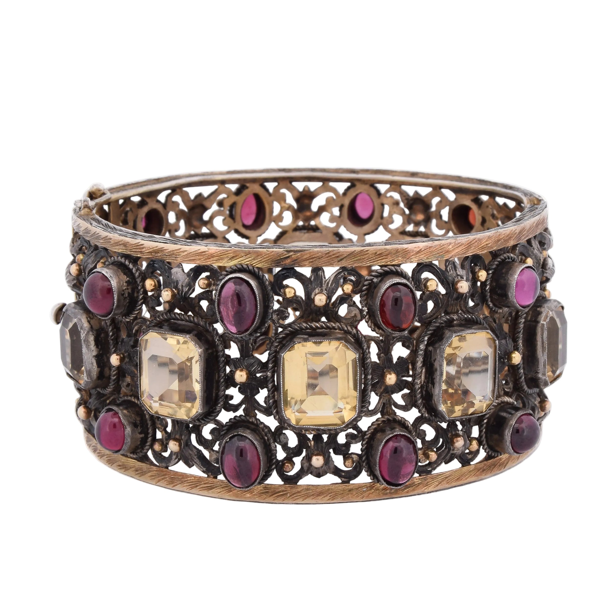 Cuff bracelet in yellow gold, silver, beryls, and garnets