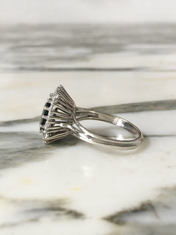 Entourage Ring in white gold, Sapphire, and Diamonds