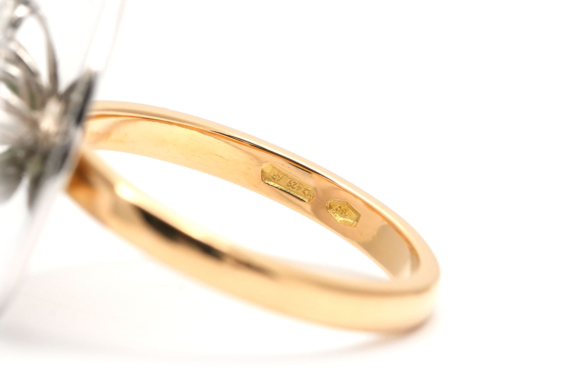 Ring in white gold, yellow gold, emeralds, and diamonds