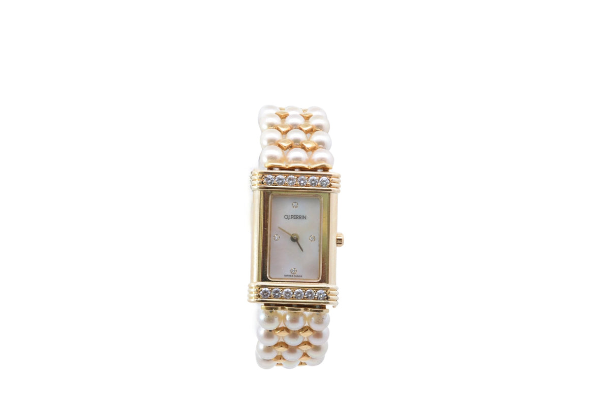 OJ Perrin watch in yellow gold, pearls, and diamonds