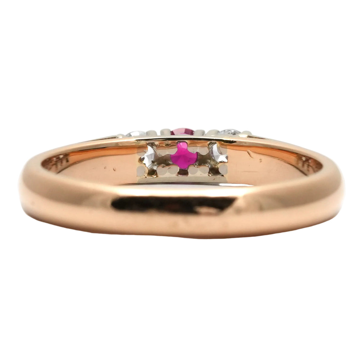 Trilogy Ring in white gold, yellow gold, rubies, and diamonds