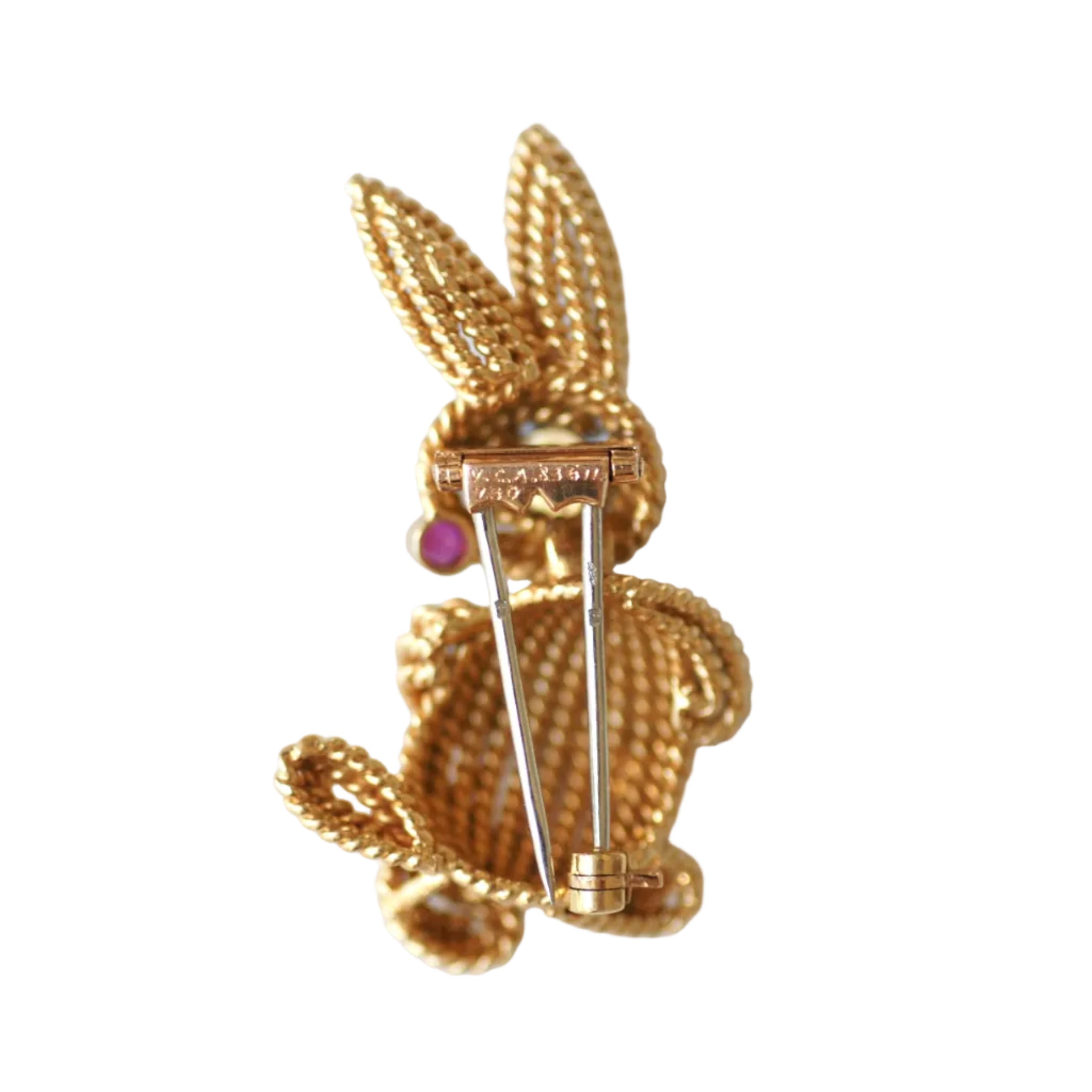 Clip Brooch in white gold, yellow gold, emerald, Ruby, and diamonds