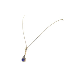 Necklace with a pendant made of yellow gold, silver, sapphire, and diamonds