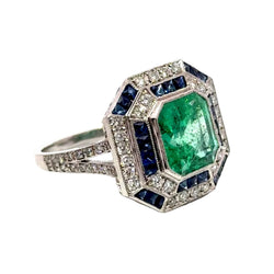 Entourage Ring in white gold, emerald, sapphire, and diamonds